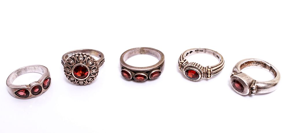 Appraisal: Sterling Silver Rings with Garnets Group of five sterling silver