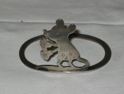 Appraisal: A MICKEY MOUSE NAPKIN RING the oval ring surmounted by