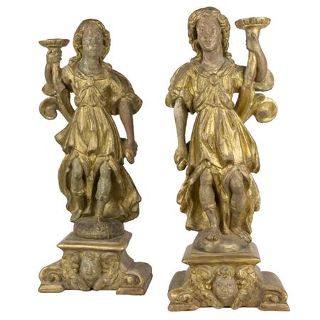 Appraisal: Pair of Continental Baroque Style Gilt-Wood Figural Candlesticks Estimate -