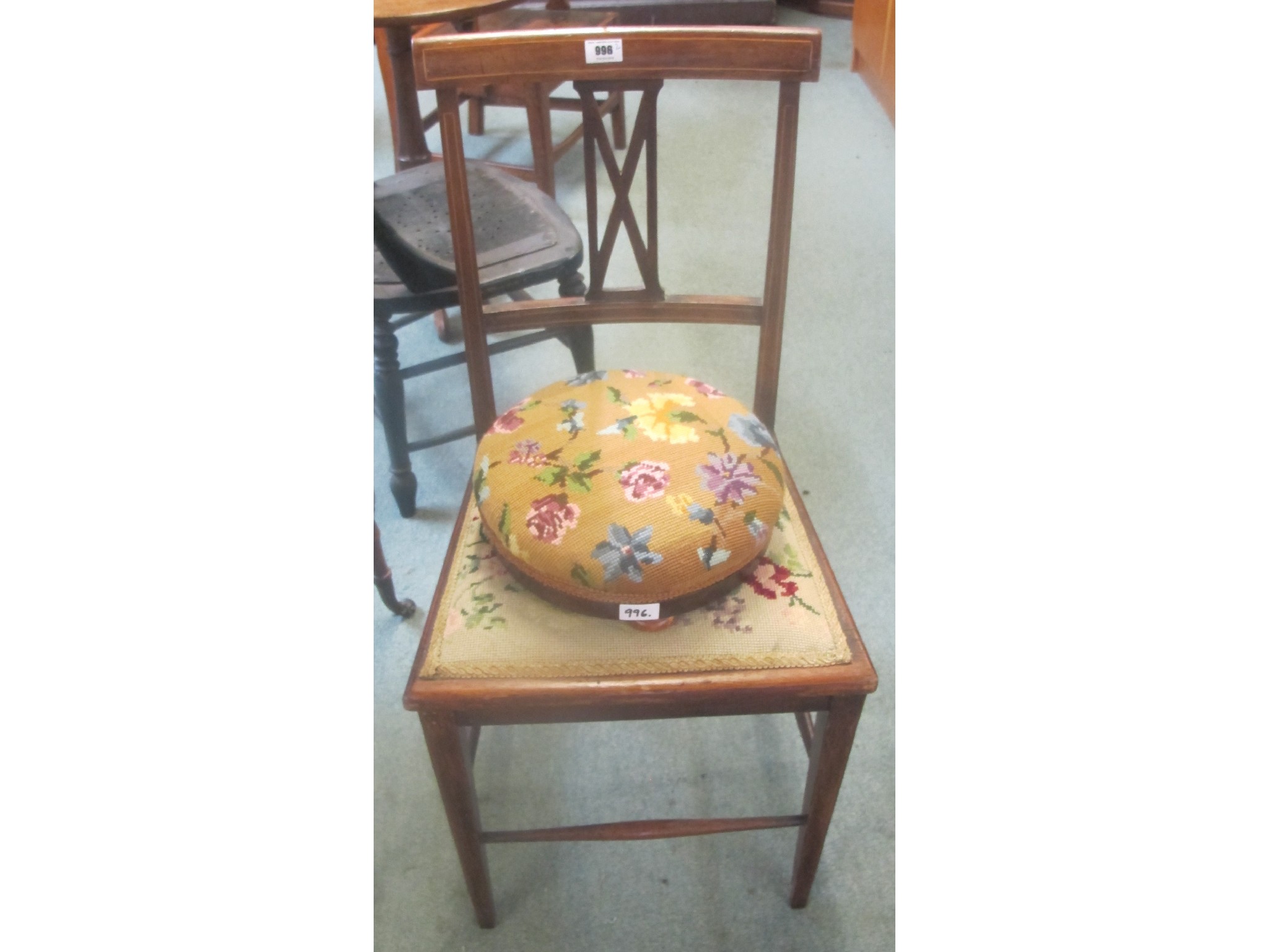 Appraisal: A mahogany parlour chair with floral design and matching footstool