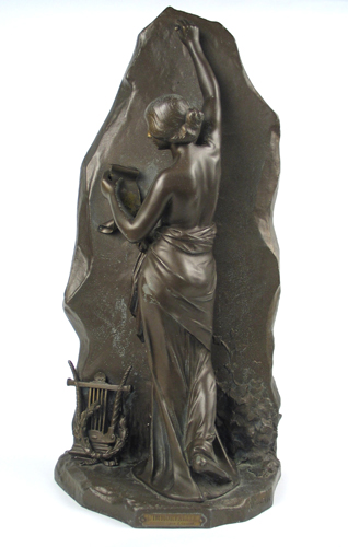 Appraisal: SPELTER PATINATED FIGURE depicting a bare breasted young woman standing