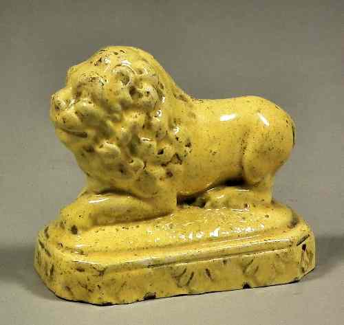 Appraisal: A small early Staffordshire pottery figure of a yellow lion