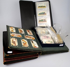 Appraisal: Four albums of cigarette cards to w nine various loose