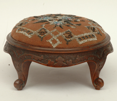 Appraisal: A VICTORIAN BEAD WORK UPHOLSTERED WALNUT FOOT STOOL