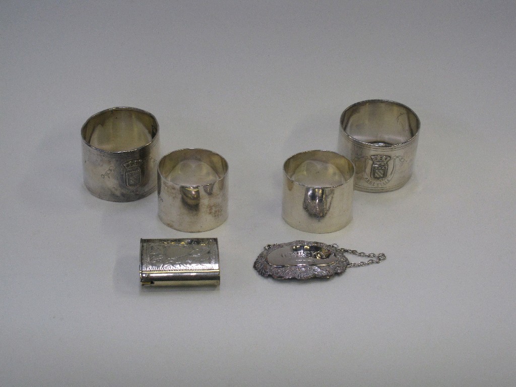 Appraisal: Lot comprising pair of silver napkin rings silver decanter label