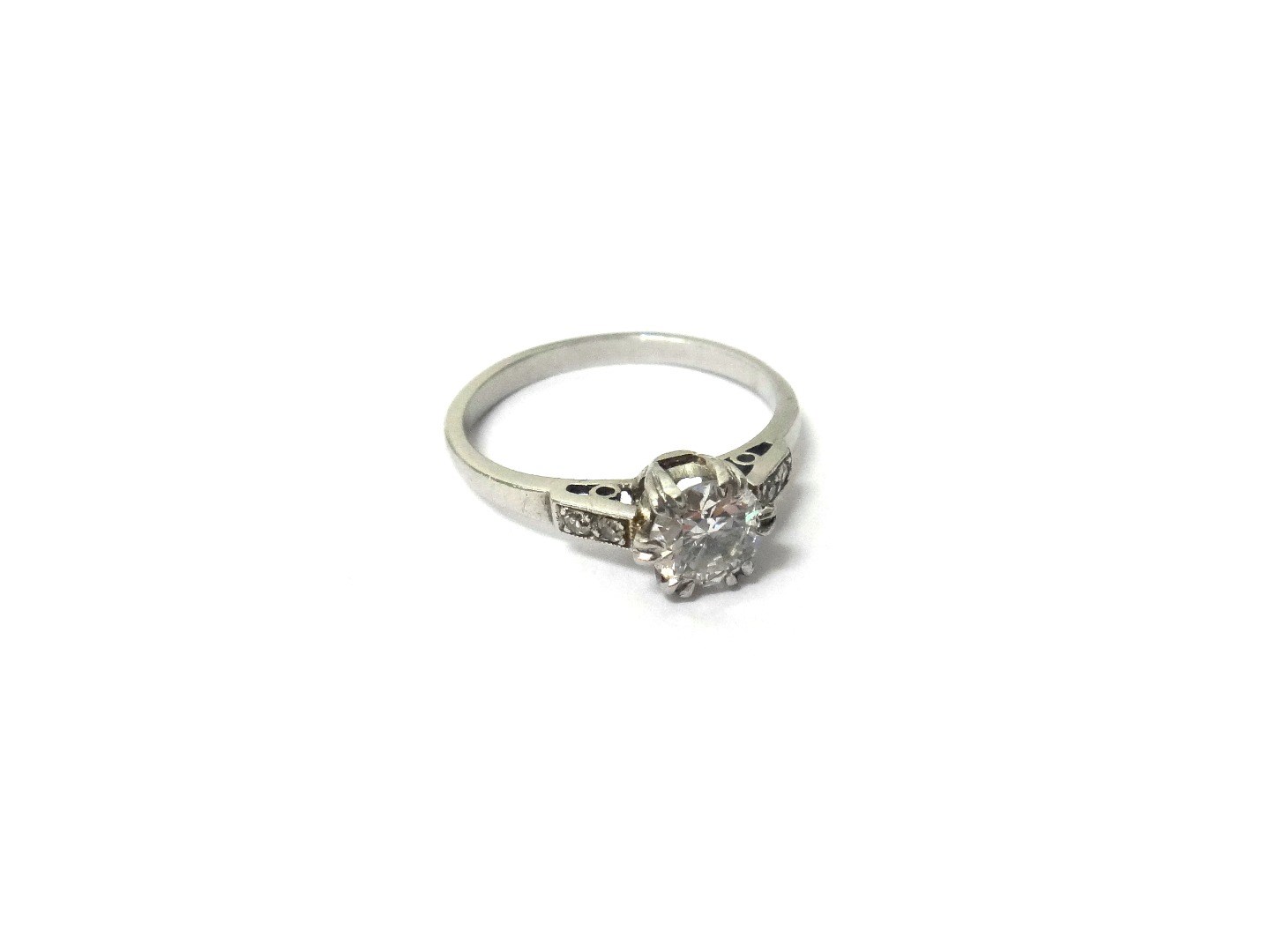 Appraisal: A diamond set single stone ring claw set with the