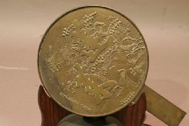 Appraisal: A Japanese bronze mirror with cast decoration of cranes and