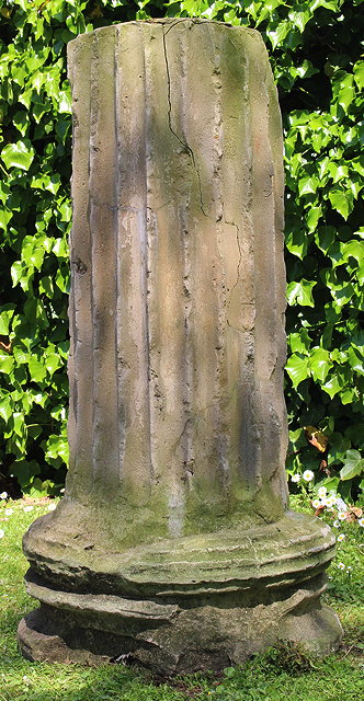 Appraisal: A RECONSTITUTED STONE FLUTED CLASSICAL COLUMN BASE on a turned