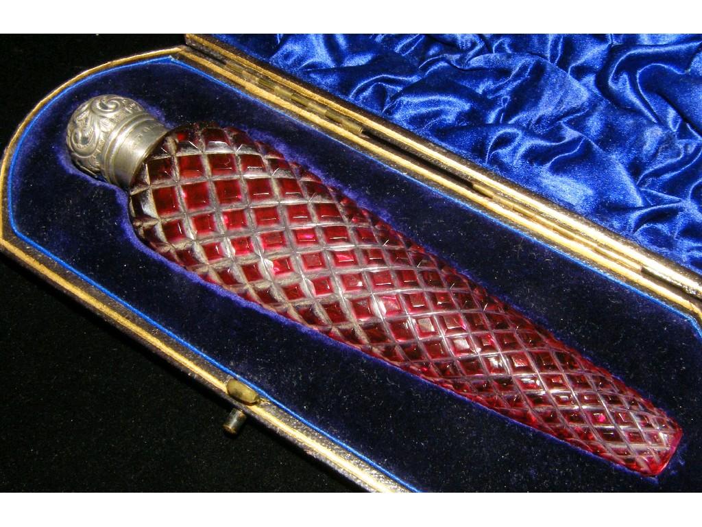 Appraisal: Edwardian silver and tapering hob cut ruby coloured scent bottle