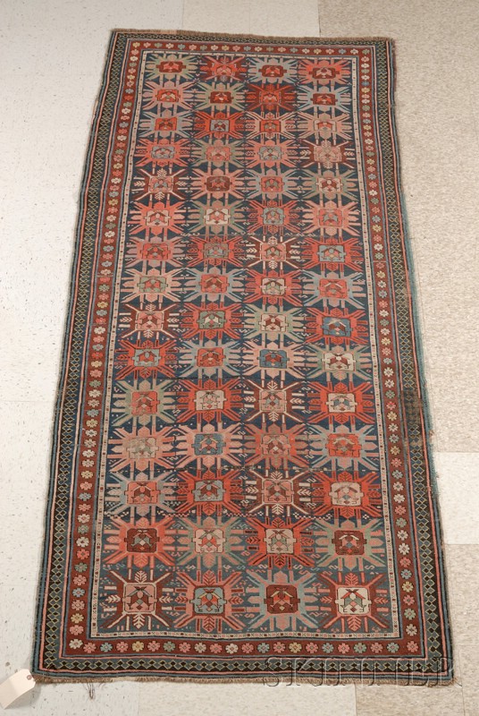 Appraisal: Caucasian Rug with midnight blue design and four rows of