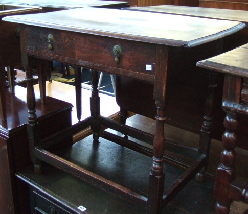 Appraisal: An th century oak side table the moulded rectangular top