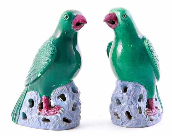 Appraisal: Pair Chinese Export parrots with green glaze perched atop pierced