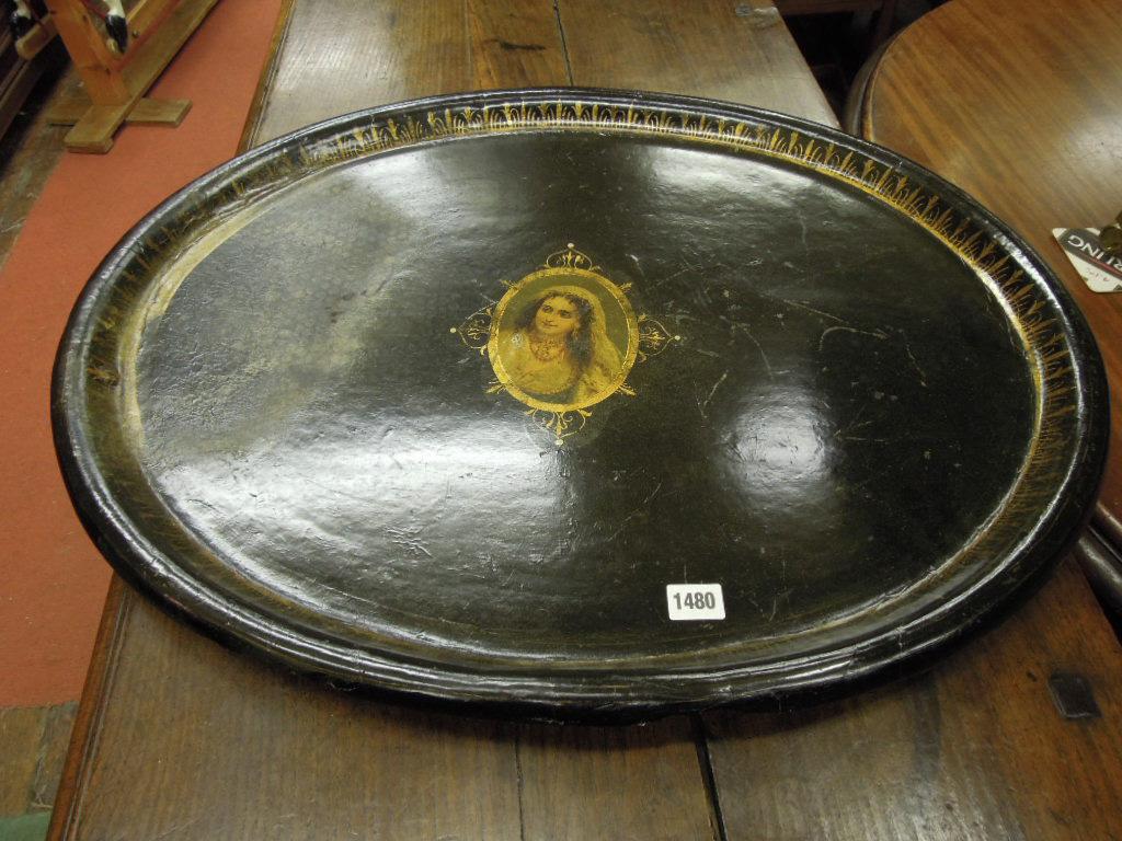 Appraisal: A Victorian papier-mache tea tray of oval form with black