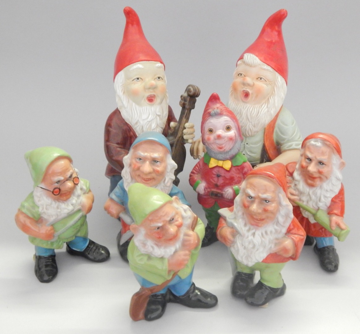 Appraisal: A group of eight painted terracotta garden gnomes to include