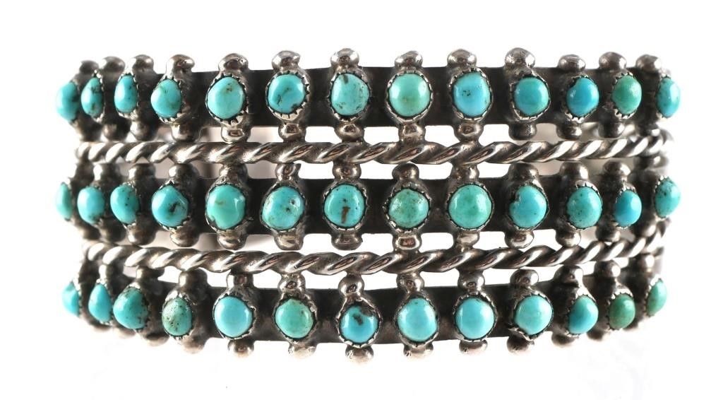 Appraisal: Sterling silver bracelet with turquoise cabochons Measures just over wide