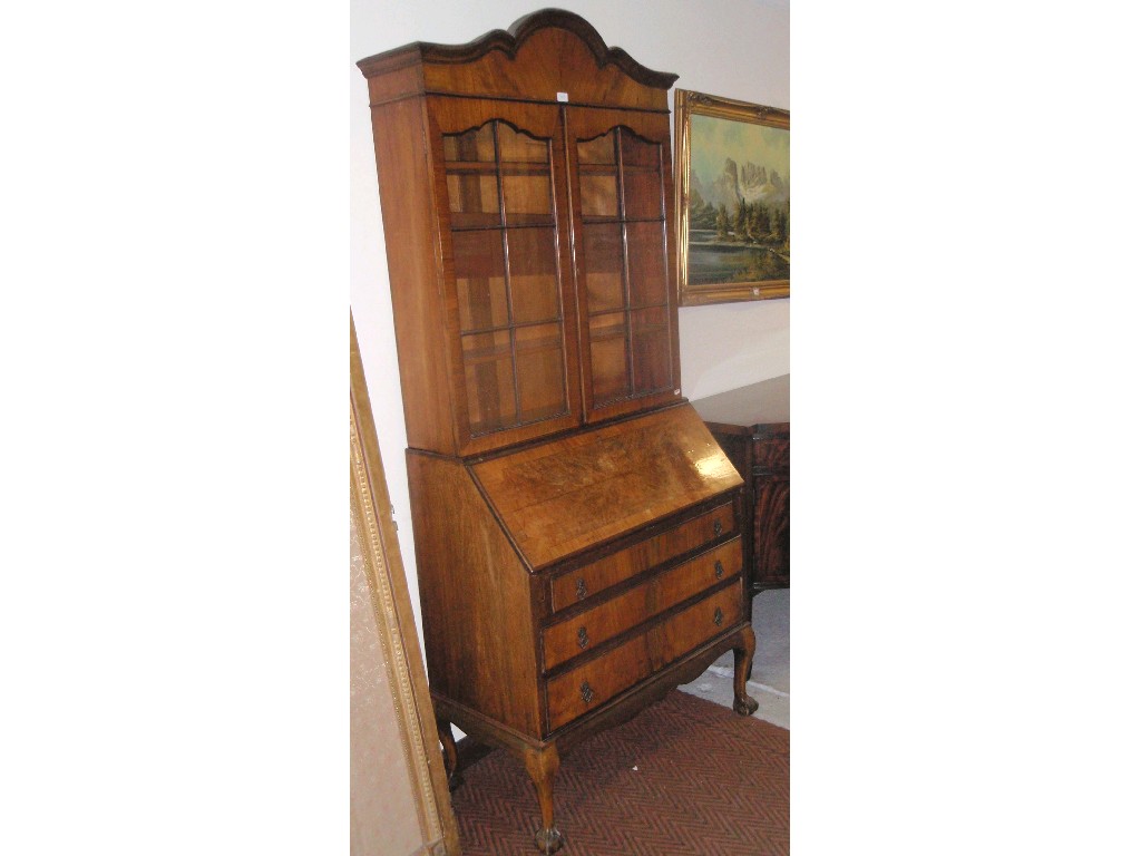 Appraisal: A Queen Anne style walnut bureau bookcase on cabriole legs