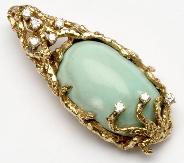 Appraisal: PERSIAN TURQUOISE AND DIAMOND FREE-FORM GOLD PENDANT k yg marked