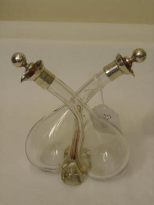 Appraisal: AN OIL AND VINEGAR BOTTLE comprising two bellied bottles with