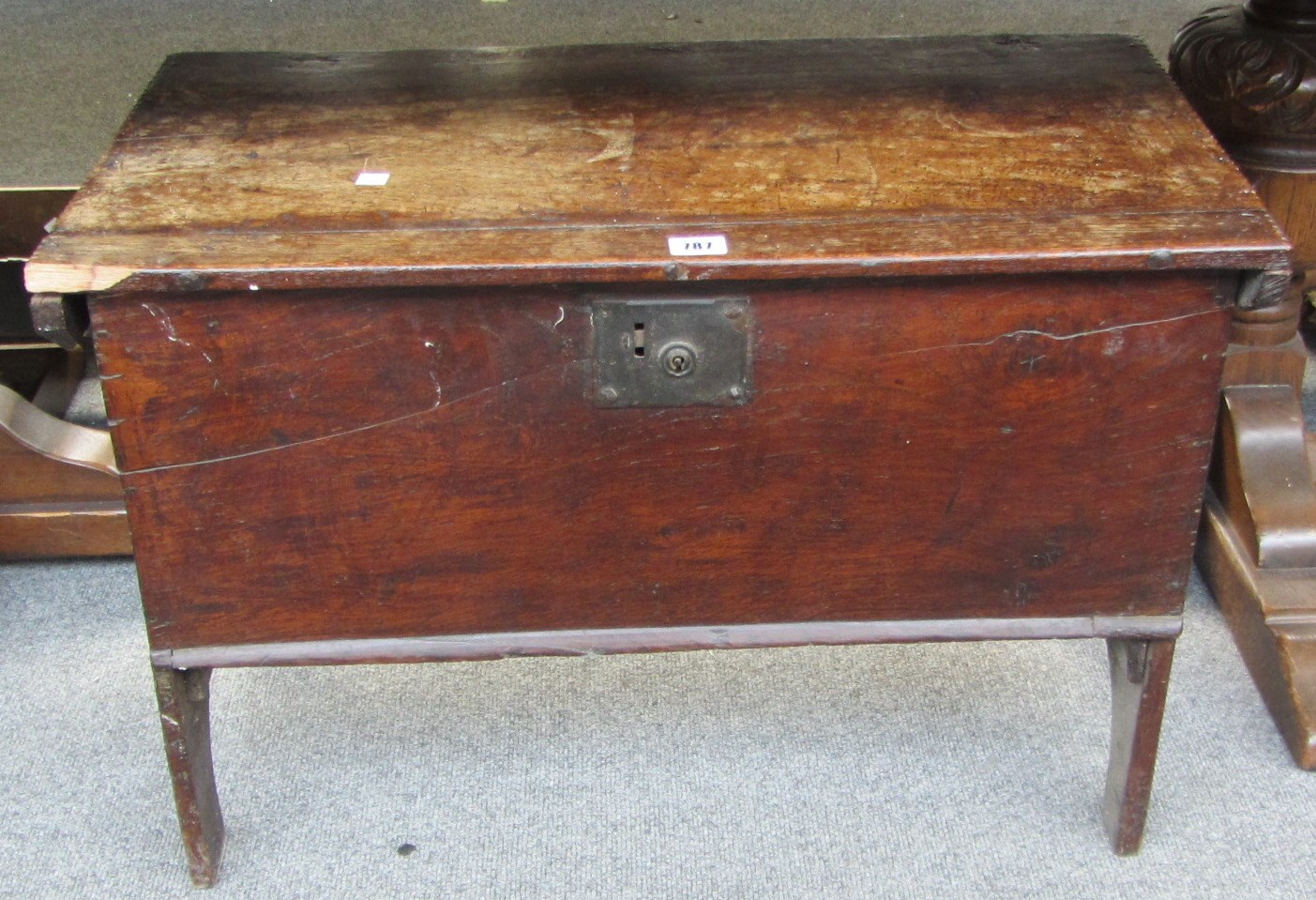 Appraisal: A th century small oak plank coffer on slab end