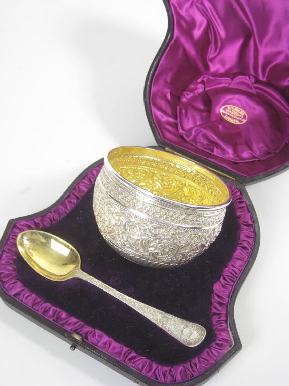 Appraisal: A Victorian Christening Bowl and Spoon with scroll embossing London