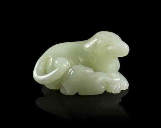 Appraisal: A Celadon Jade Carved Toggle depicting a recumbent dog with