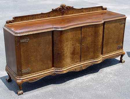 Appraisal: RICHLY GRAINED BURLED WALNUT SIDEBOARD With gadroon edging acanthus leaf