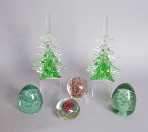 Appraisal: Three glass paperweights together with a pair of glass trees