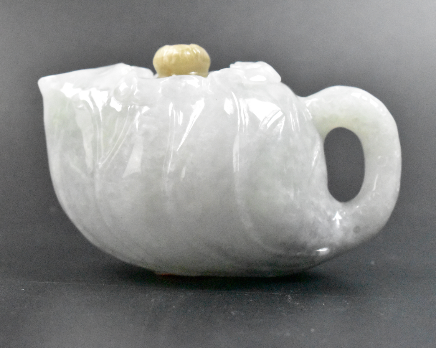 Appraisal: A Chinese jadeite teapot with lid Small jadeite teapot with