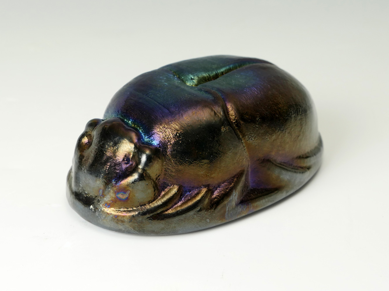 Appraisal: ZEPHYER GLASS STUDIO SCARAB Iridescent oil spill colored scarab by