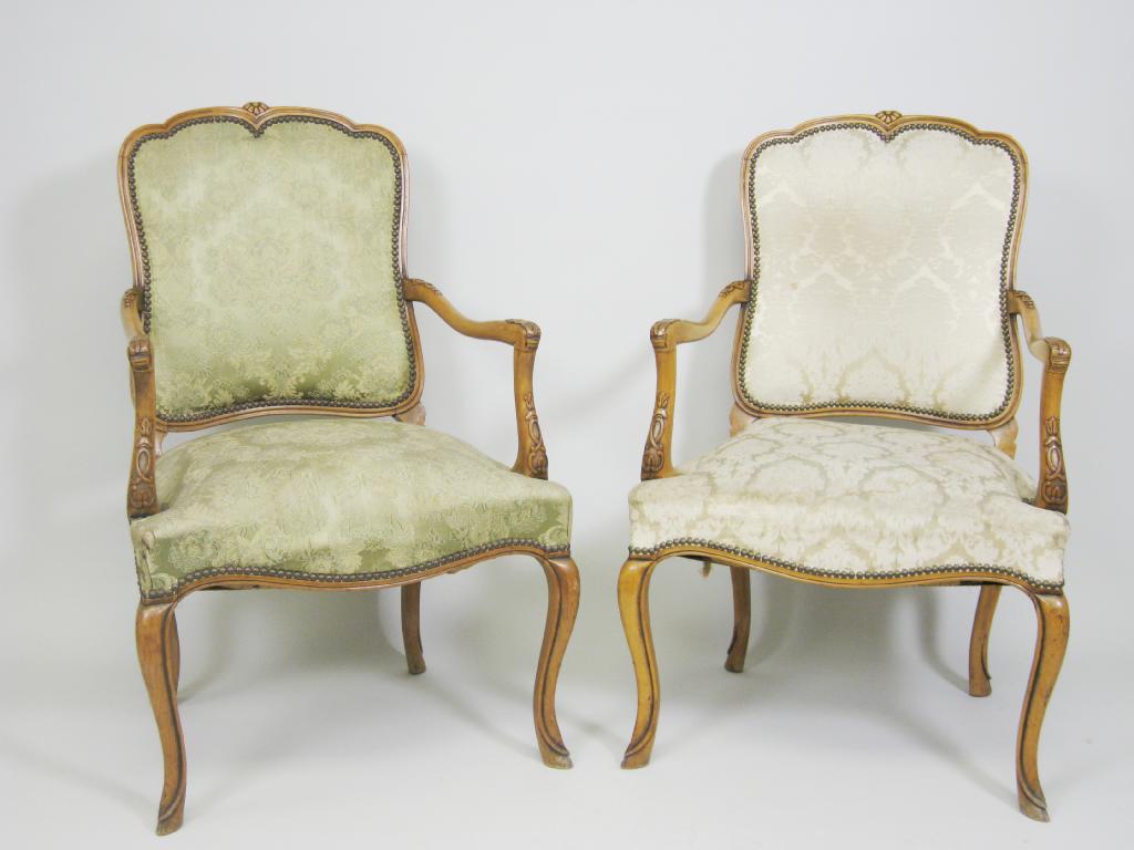 Appraisal: A pair of French beechwood Elbow Chairs with upholstered backs