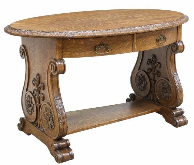 Appraisal: American quarter sawn oak library table c oval top with