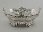 Appraisal: A large late Victorian silver open basket on shell feet