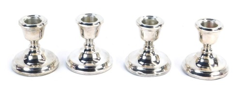 Appraisal: A set of four George V silver dwarf candlesticks each