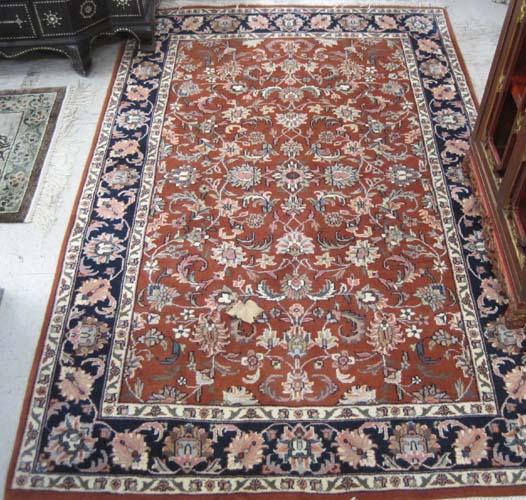 Appraisal: HAND KNOTTED ORIENTAL AREA RUG Indo-Persian overall floral pattern on