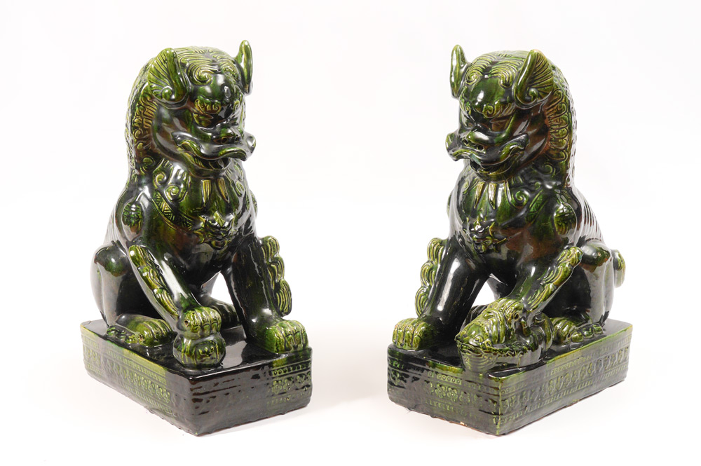 Appraisal: PAIR LARGE CHINESE GREEN GLAZE EARTHENWARE FOO DOGS Matched pair