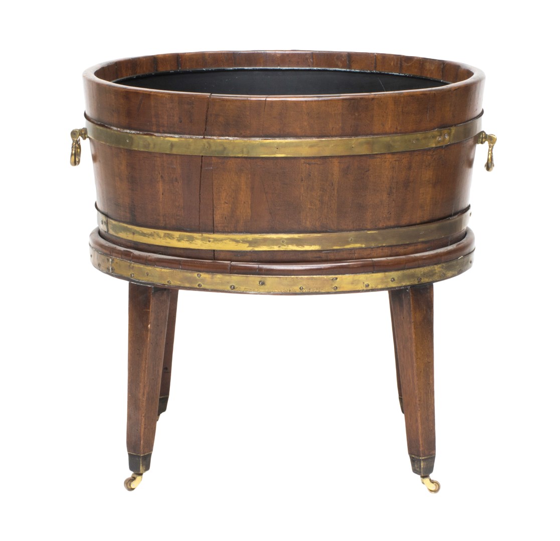 Appraisal: A George III brass bound oval mahogany wine cooler on