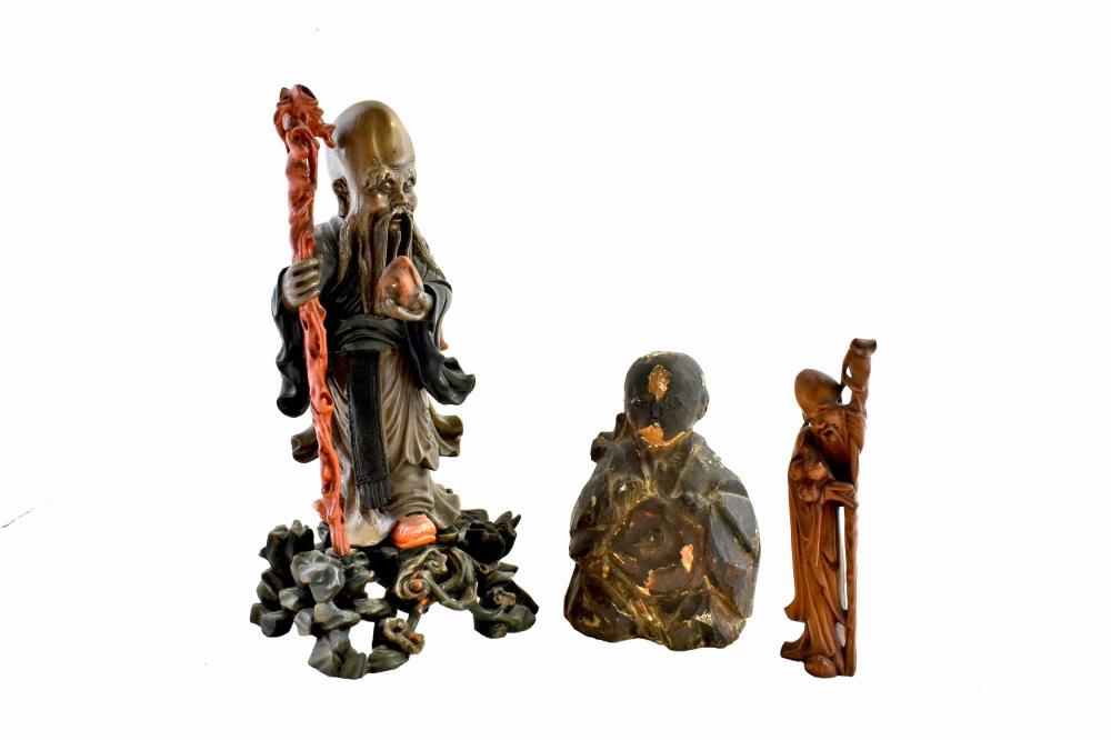 Appraisal: THREE CHINESE CARVED WOOD FIGURESThe first a well patinated soft