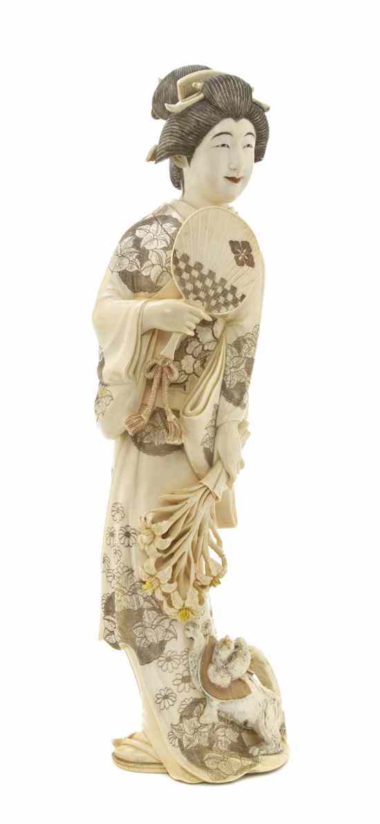 Appraisal: A Japanese Carved Ivory Figure depicting a standing female figure