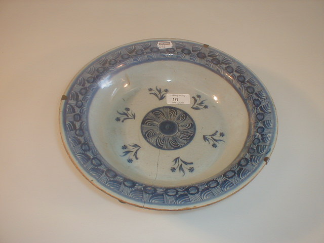 Appraisal: An thC Delft dish painted to the centre with a