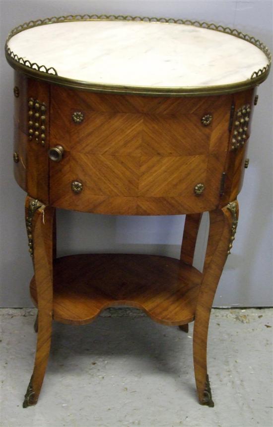 Appraisal: French kingwood oval bedside cabinet the white marble top above