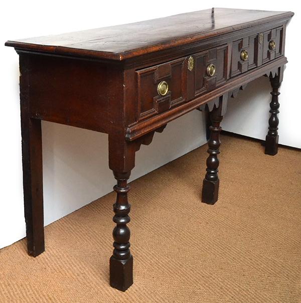 Appraisal: A GEORGE III OAK DRESSER BASE rectangular with two geometric