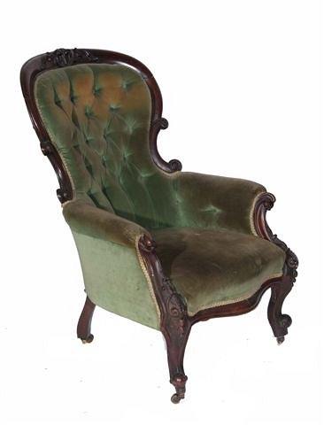 Appraisal: A VICTORIAN MAHOGANY CARVED ARMCHAIR with shaped back with buttoned