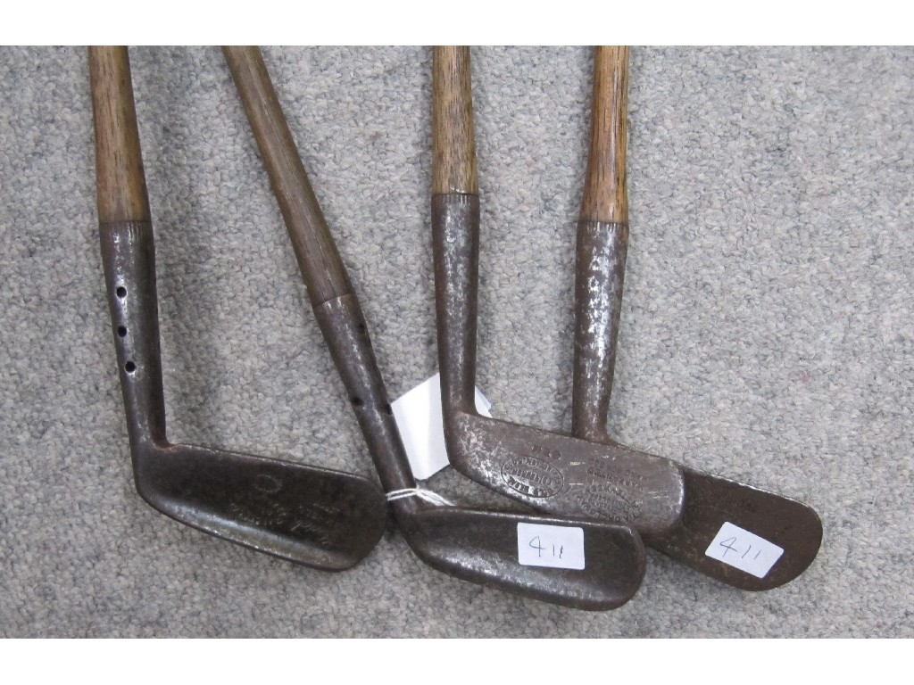 Appraisal: Lot comprising four hickory shafted golf clubs