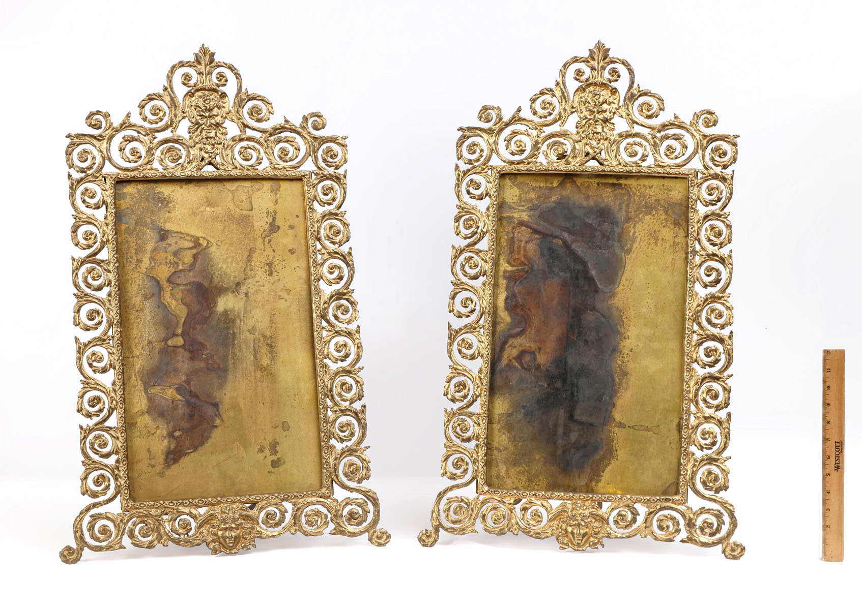 Appraisal: PAIR OF BRASS ORNATE FRAMES WITH MASQUERON Pair of gilt