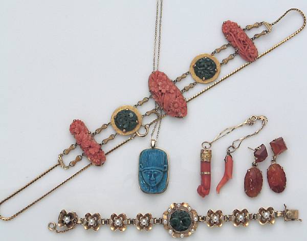 Appraisal: A collection of coral stone carnelian pearl ceramic and gold