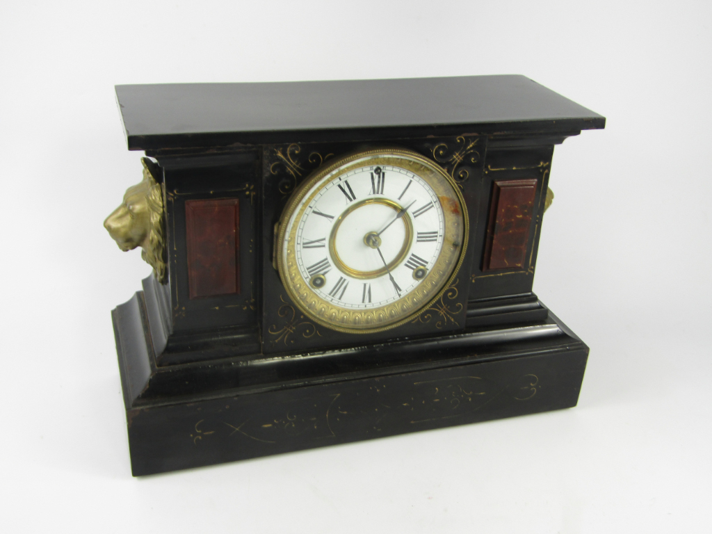 Appraisal: An Ansonia Clock Company cast iron and marble cased mantel