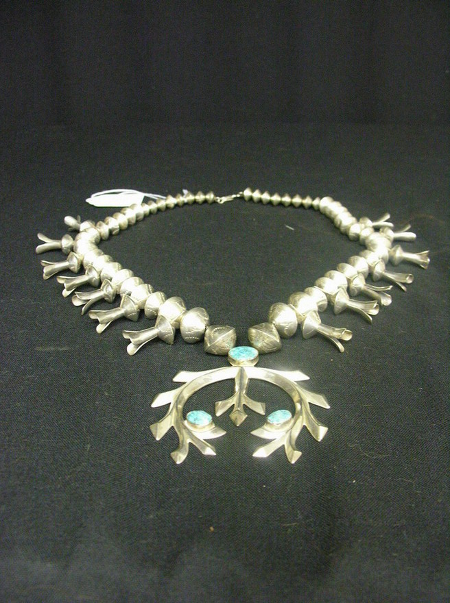 Appraisal: SILVER SQUASH BLOSSOM NECKLACE Native American silver bead with turquoise