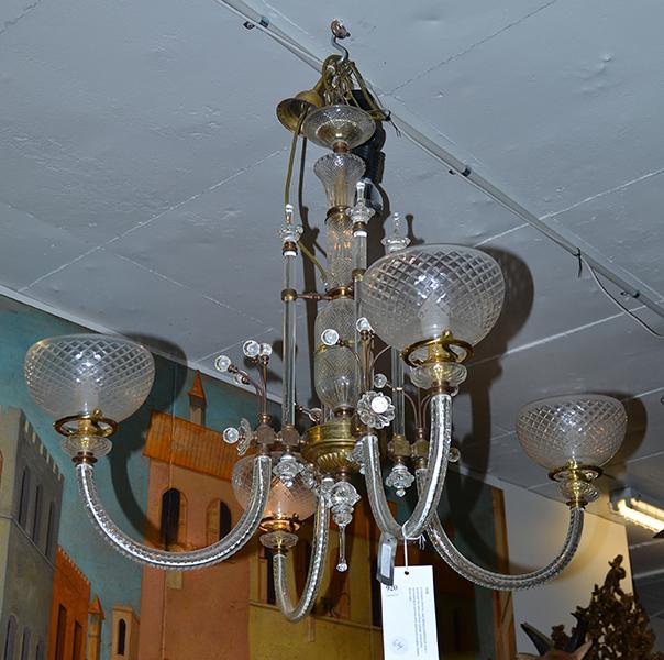 Appraisal: A CRYSTAL AND BRASS CHANDELIER with a quadripartite stem and