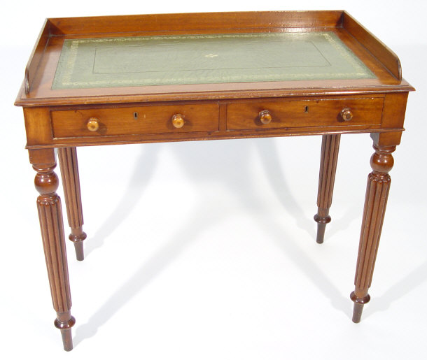 Appraisal: Victorian mahogany writing table with galleried top and tooled green