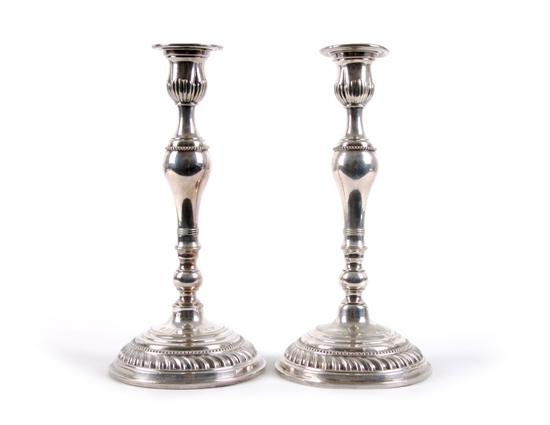 Appraisal: A Pair of Silvered Candlesticks Height inches